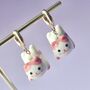 Pink Ceramic Cat Huggie Hoops Earrings, thumbnail 1 of 6