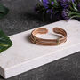 Textured Copper Healing Cuff With Brass Wrap Detail, Unisex Model, thumbnail 2 of 2