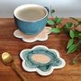 Handmade Flower Shaped Ceramic Coasters In Orange And Green, thumbnail 4 of 7