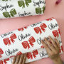 Personalised Bow And Name Christmas Wrapping Paper, thumbnail 1 of 2