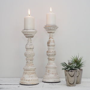 grey wooden candlesticks