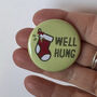 Naughty Xmas Badge 'Well Hung', thumbnail 2 of 5