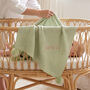 Personalised Sage Green Knitted Baby Blanket With Pom Poms, thumbnail 1 of 9
