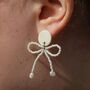 White Porcelain Earrings With Beaded Bow And Pearls, thumbnail 1 of 3