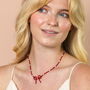 Pearl And Red Beaded Bow Pendant Necklace, thumbnail 1 of 5