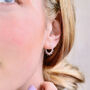 Sterling Silver Sunburst Huggie Hoop Earrings, thumbnail 1 of 6