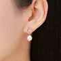 Sterling Silver Circle With Dangling Baroque Pearl Drop Stud Earrings, thumbnail 1 of 12