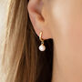 Mini Pearl Drop Huggie Earrings, thumbnail 1 of 5