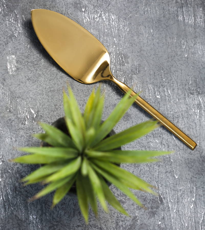 gold cake slice in presentation box by the forest & co