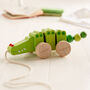 Personalised Christening Pull Along Wooden Crocodile, thumbnail 2 of 3