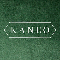 Kaneo logo on green velvet background