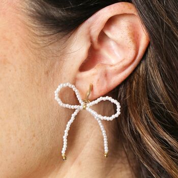 Stainless Steel Pearl Bow Stud Earrings In Gold, 3 of 3