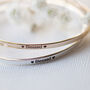Blessed Slim Brass Bangle In Gold Or Silver Finish, thumbnail 2 of 12
