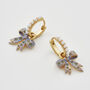 Gold Forget Me Not Bow Huggie Earrings, thumbnail 6 of 9