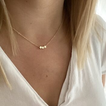 Tiny Gold Star Necklace, 2 of 11