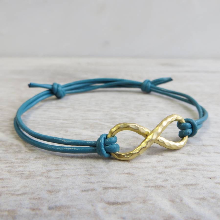 large yellow gold infinity charm and leather bracelet by gracie collins