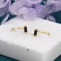 Sterling Silver Tiny Black Baguette Cut Cz Huggie Hoop Earrings, thumbnail 1 of 10