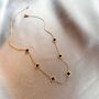 Six Small Clover Necklace In Black And Gold, thumbnail 1 of 4