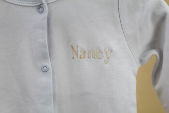 Embroidered White Cotton Baby Sleepsuit, 6 of 6