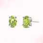 Peridot Oval Stud Earrings In Sterling Silver And Gold, thumbnail 1 of 9