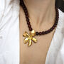 Red Wine Bead And Sculptural Flower Pendant Necklace, thumbnail 1 of 6
