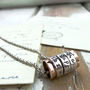 Silver And Copper Spinning Ring Pendant, thumbnail 1 of 7