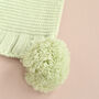 Personalised Sage Green Knitted Baby Blanket With Pom Poms, thumbnail 7 of 9