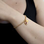 Personalised Gold And Red Sacred Heart Ball Bracelet, thumbnail 2 of 4
