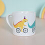Cycling Dinosaur Children's Ceramic Mug, thumbnail 1 of 8