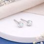 Sterling Silver White Opal Micro Stud Earrings – 4mm, thumbnail 1 of 9