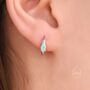 Sterling Silver Oval White Opal Huggie Hoop Earrings, thumbnail 5 of 10