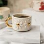 Handmade Daisy Ceramic Mug With Golden Handle, thumbnail 1 of 3