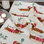 Personalised Festive Sausage Dog Tea Towel, thumbnail 1 of 4