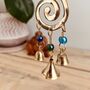 Handmade Fair Trade Brass Swirl Bell Wind Chime, thumbnail 4 of 6