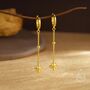 Sterling Silver Dangling Starburst Huggie Hoop Earrings, thumbnail 3 of 11