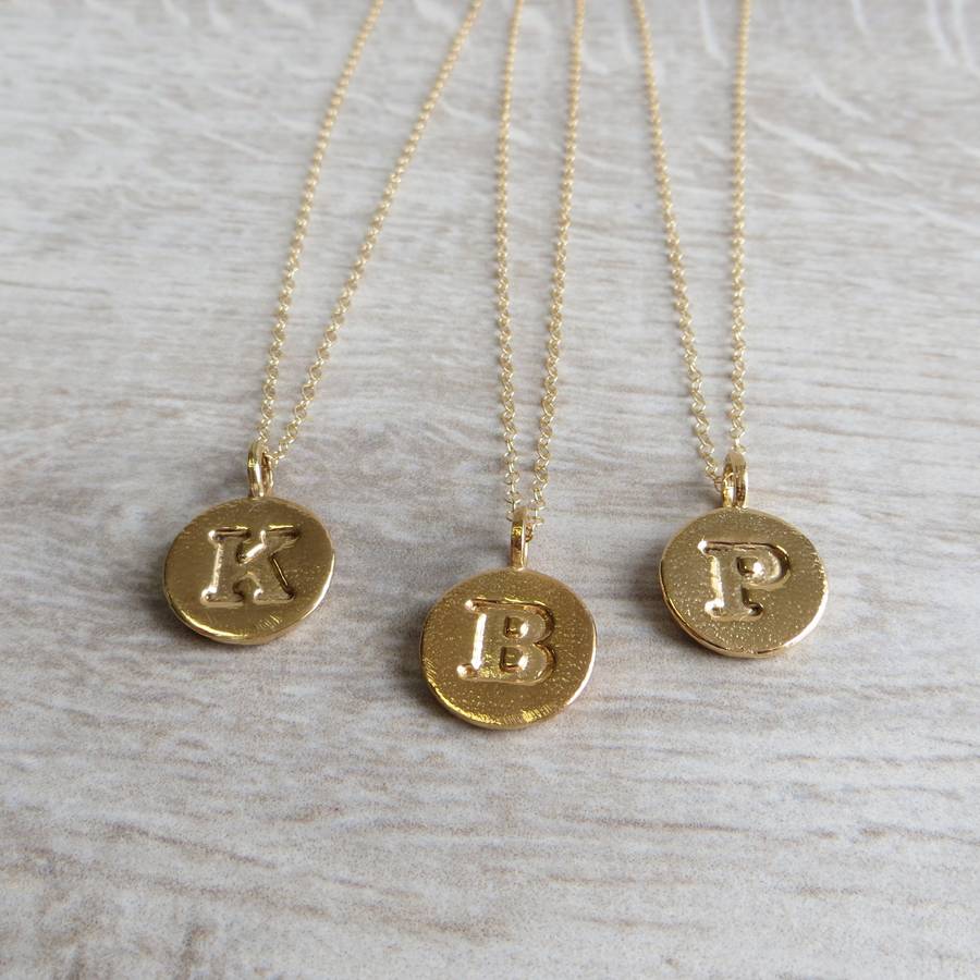 gold embossed letter necklace by gracie collins