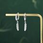 Sterling Silver Tiny Feather Huggie Hoops, thumbnail 1 of 12