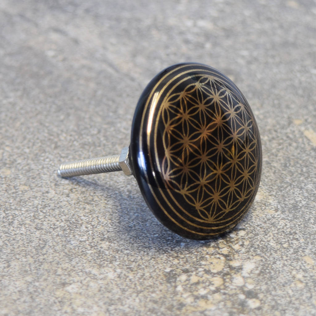 black and gold round patterned ceramic cupboard knobs by pushka home
