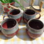 Set Of Four Reactive Glaze Sphere Mugs In Maroon And Grey Mist Haze, thumbnail 3 of 9