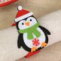 Set Of Four Christmas Penguin Felt Napkin Rings, thumbnail 3 of 4