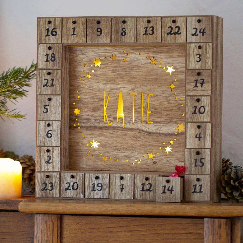personalised wooden stars advent calendar light box by lisa angel