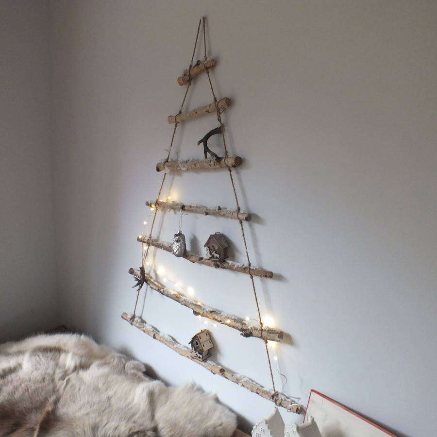 Snowy branch hanging christmas tree by magpie living 
