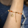 Carnelian Gemstone Bead And Sun Charm Bracelet, thumbnail 2 of 4