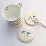 Handmade Ceramic Coasters With Blue Flowers, thumbnail 1 of 4