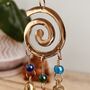 Handmade Fair Trade Brass Swirl Bell Wind Chime, thumbnail 2 of 6