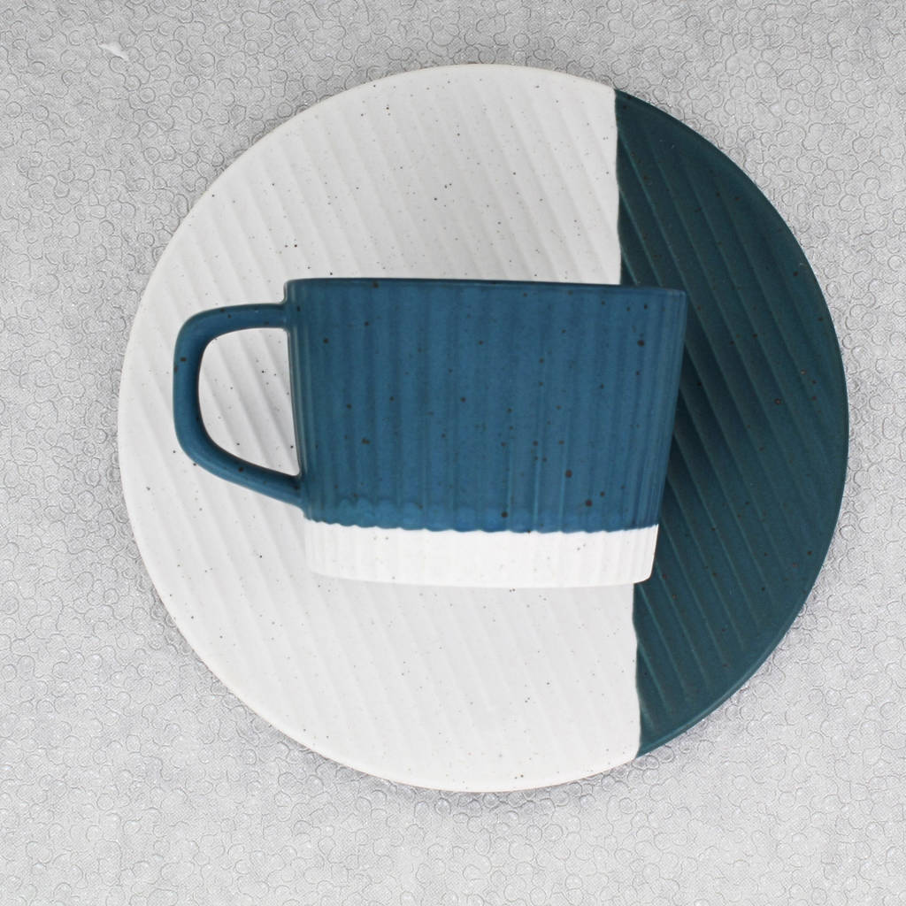 blue and white matching cup and saucer by g decor