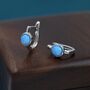 Sterling Silver Blue Opal Huggie Hoop Earrings, thumbnail 1 of 11