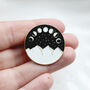 Moon Phase Enamel Pin Badge In Black, White And Gold, thumbnail 1 of 3