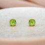 Mini 9ct Yellow Gold Peridot Stud Earrings, thumbnail 1 of 7