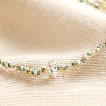 Crystal Blue And White Beaded Cord Bracelet In Gold, 2 of 3